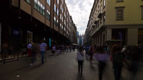 italy milan city famous shopping street crowded rotating panorama 4k timelapse