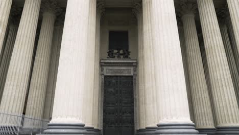 facade of a historical cathedral with columns