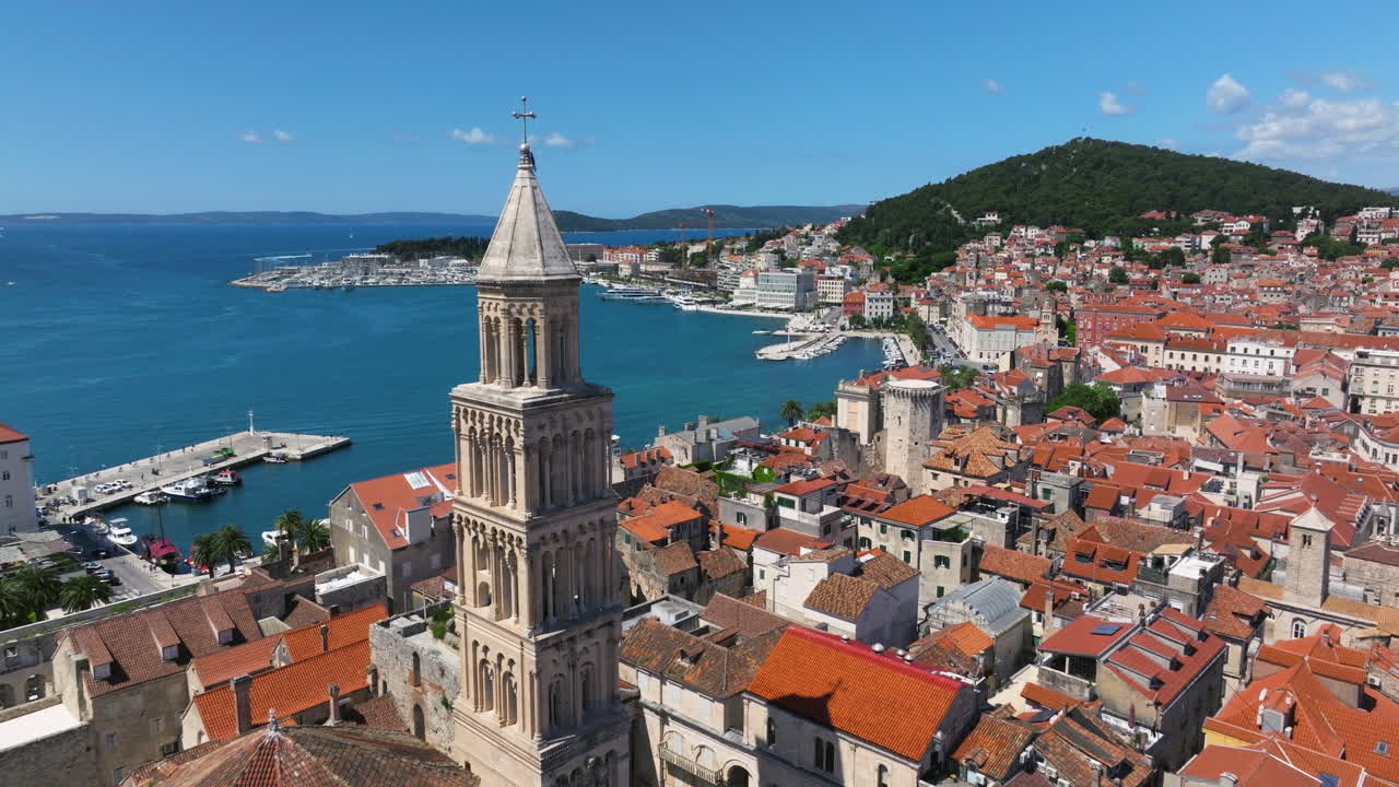 Waterfront Old Town of Split With Saint Domnius Cathedral Bell Tower In Croatia. - aerial pullback shot