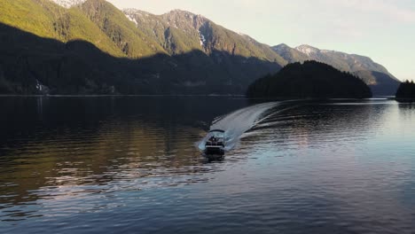 Drone-shot-of-a-boat-in-Indian-Arm-ocean-in-Vancouver,-Canada