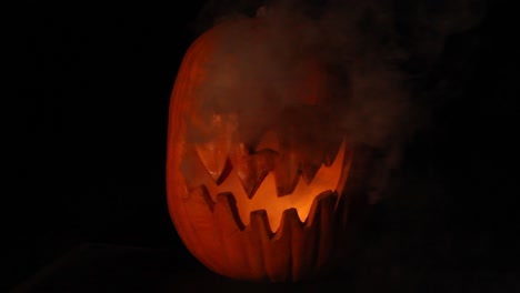 smoking tall jack o lantern with flickering pumpkin light halloween centered