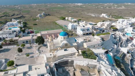 Witness-the-bustling-activity-of-Thira-port,-as-cruise-ships-anchor-in-the-midst-of-Santorini's-enchanting-scenery