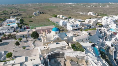 Witness the bustling activity of Thira port, as cruise ships anchor in the midst of Santorini&#039;s enchanting scenery