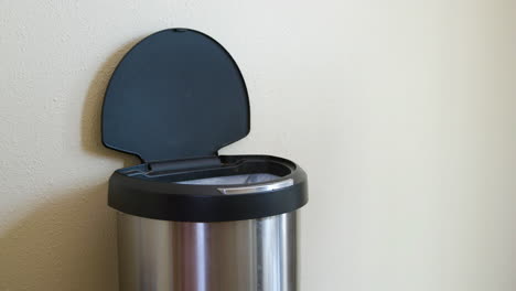 Man-Throws-Away-Milk-Jug-in-Motion-Sensing-Touchless-Trash-Can---Medium-Side