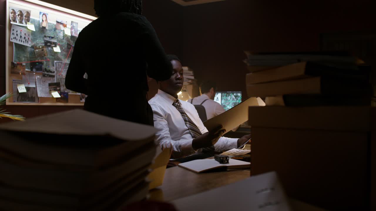 Police Investigators Discussing Evidence in a Crime Scene