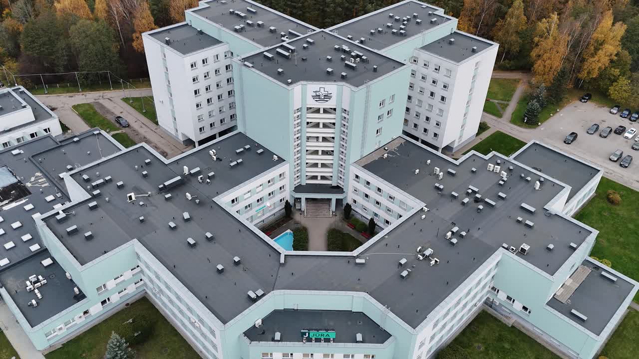 A large hospital complex with central courtyard surrounded by tall buildings, aerial view