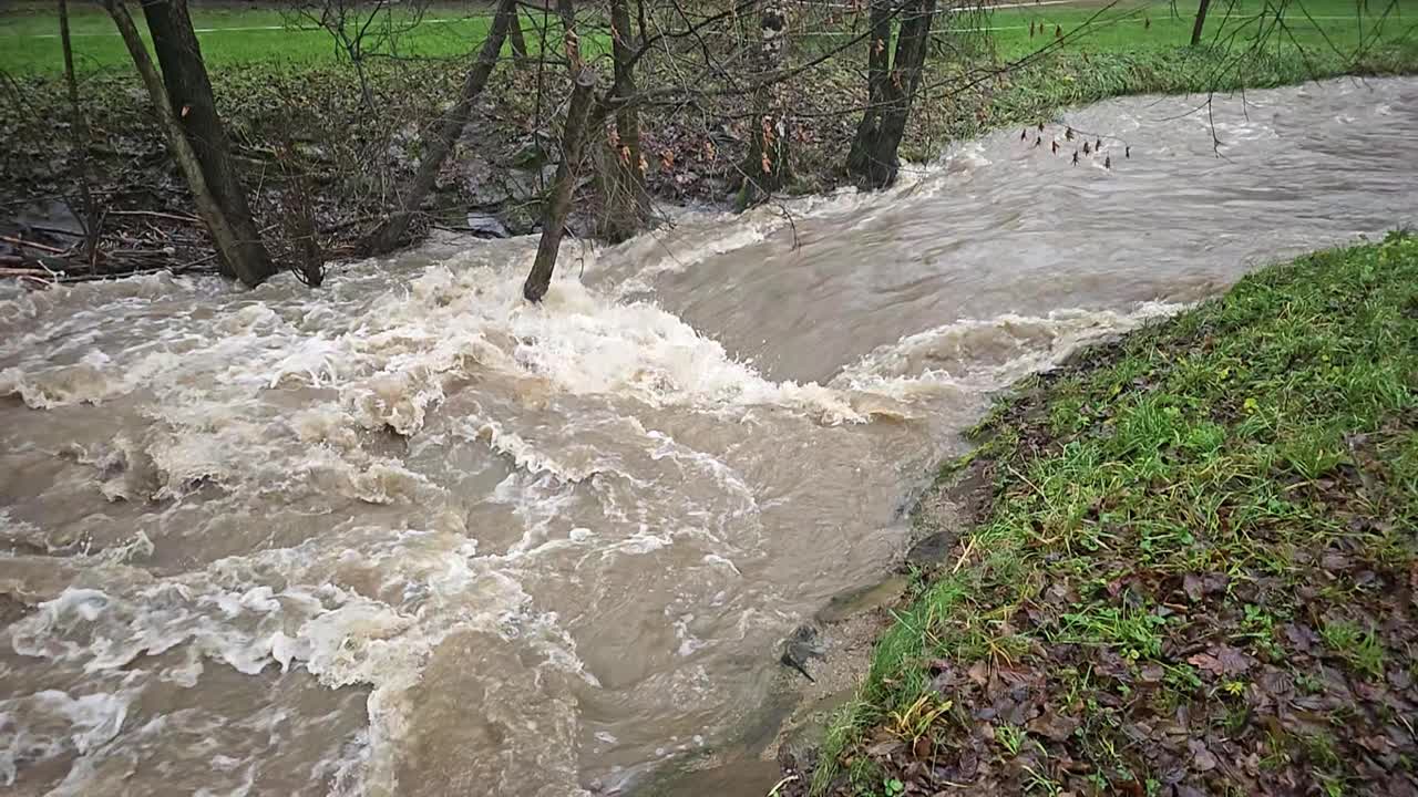 Muddy River Flowing Rapidly During High Water