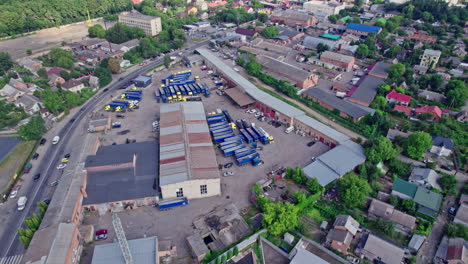 semi-trucks with freight trailers standing at the ramps