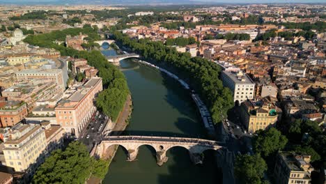 drone flying away from ponte sisto bridge in historic rome, italy