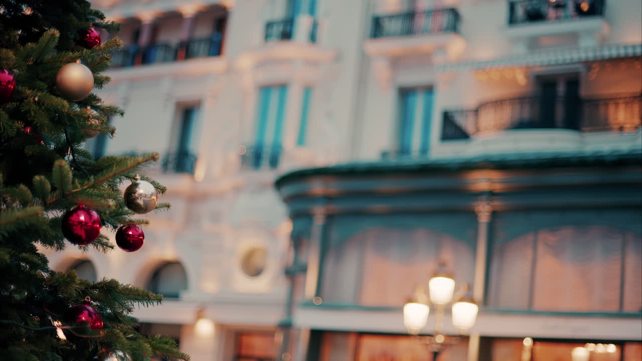 Close up of decorations on a Christmas tree in front of the Monte Carlo Casino in Monaco