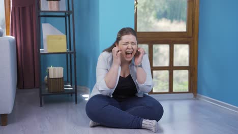 Young-woman-having-a-nervous-breakdown-by-the-wall.