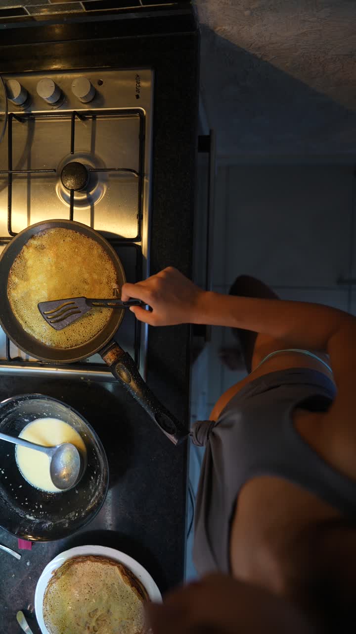 Woman cooking pancakes