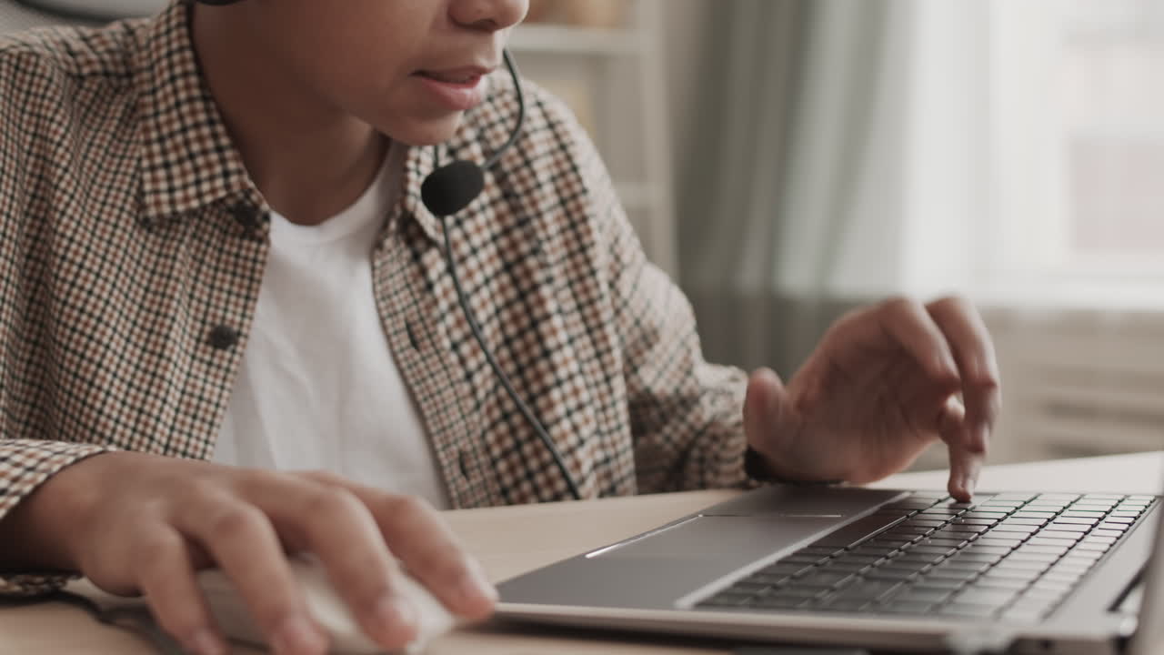 Unrecognizable Boy Playing Computer Game