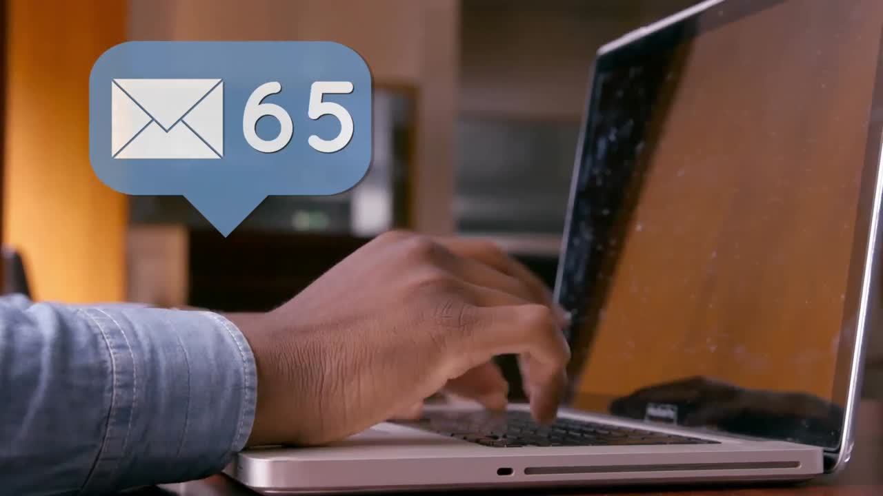 Pair of hands typing on a laptop