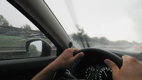 driving through heavy rain with clear vision ahead