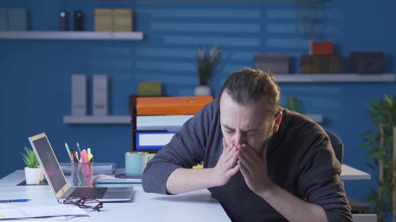 The infected young man is sneezing.