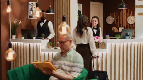 Elderly-woman-arrives-at-front-desk