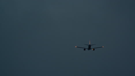 airplane in the dark sky