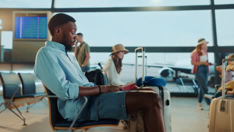 people waiting in airport terminal