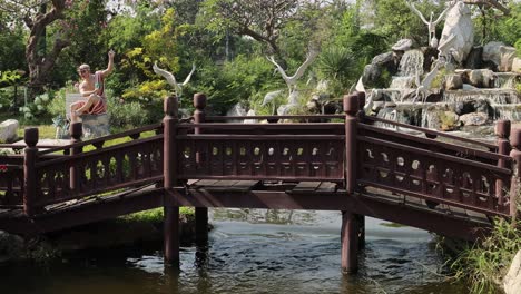 individual performing dance on a scenic bridge