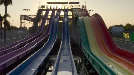 colorful water slides at sunset