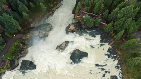 Aerial-View-of-Athabasca-Falls-in-Jasper,-Alberta,-Canada---4K-River-Waterfall---Tourism-and-Destination-Spots