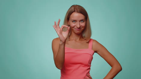 woman looking approvingly, showing ok approve feedback gesture like sign positive something good