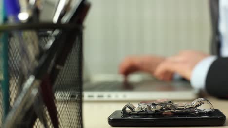 close up businessman using computer in office