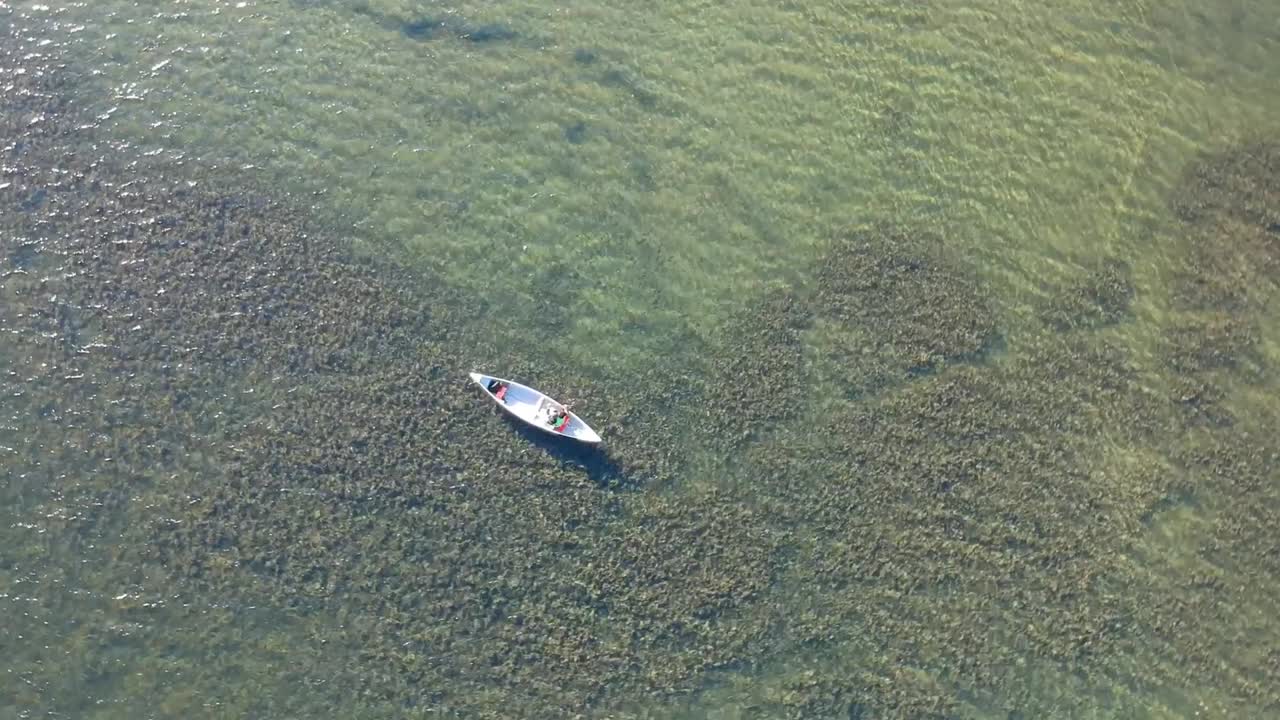 Drone shot of canoeing on a lake in BC Canada