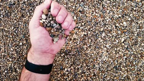 Slow-motion-of-rocks-falling-out-of-hand