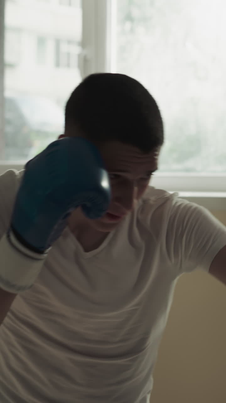 Sportsman and trainer friendly sparring in sports gym. Professional athletes battle exercising in martial arts club slow motion. Boxers training