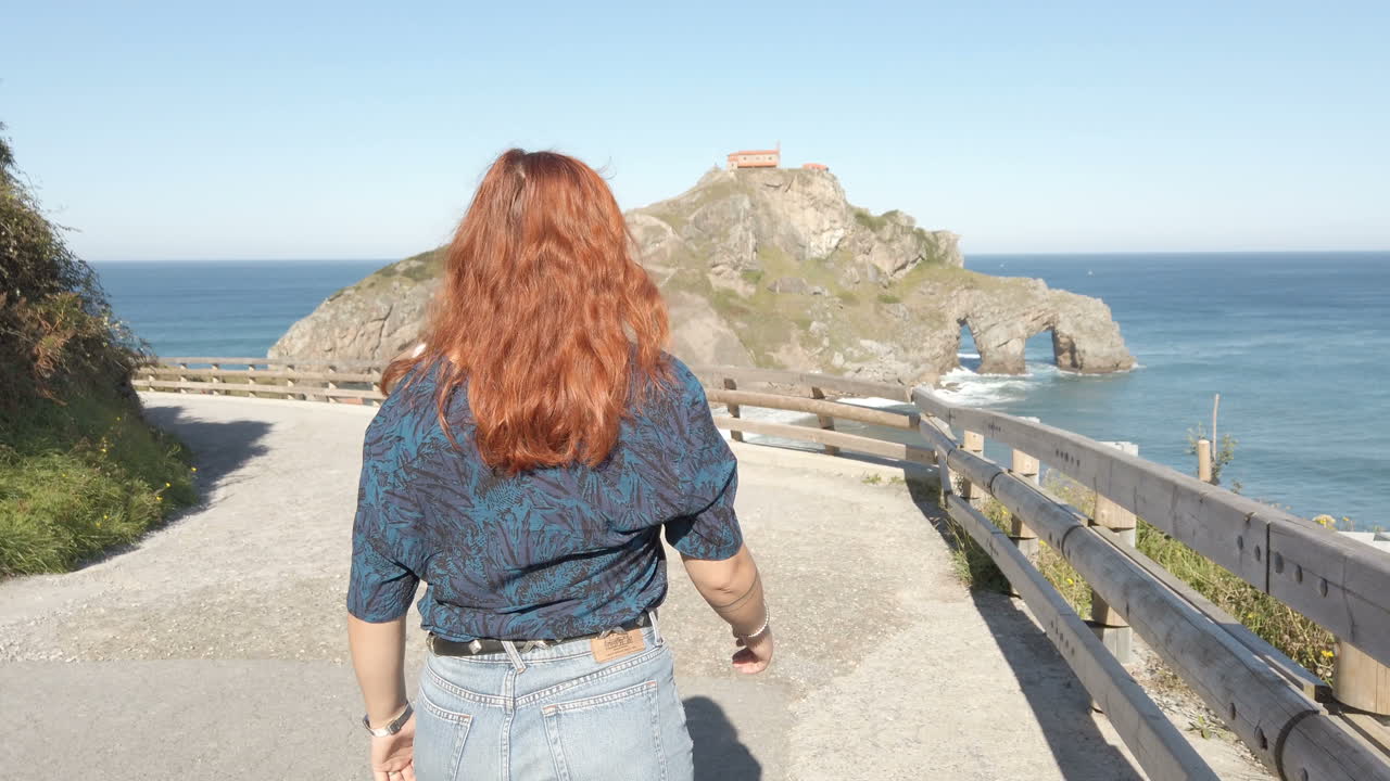 Woman at a scenic coastal location