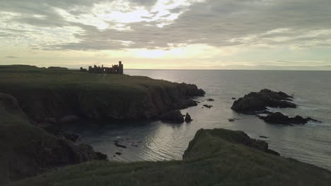 aerial view of a slains castle ruin at sunrise, aberdeenshire, scotland