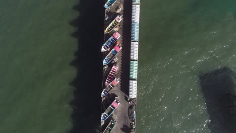boats and restaurant on puerto maguillines in constitucion, maule, chile at summer