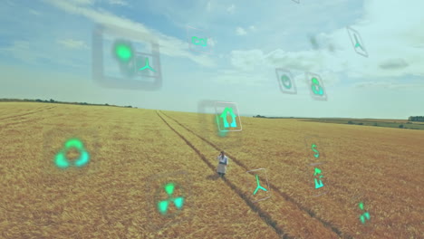 mature man standing on tractor tracks in wheat field, viewing floating renewable energy icons