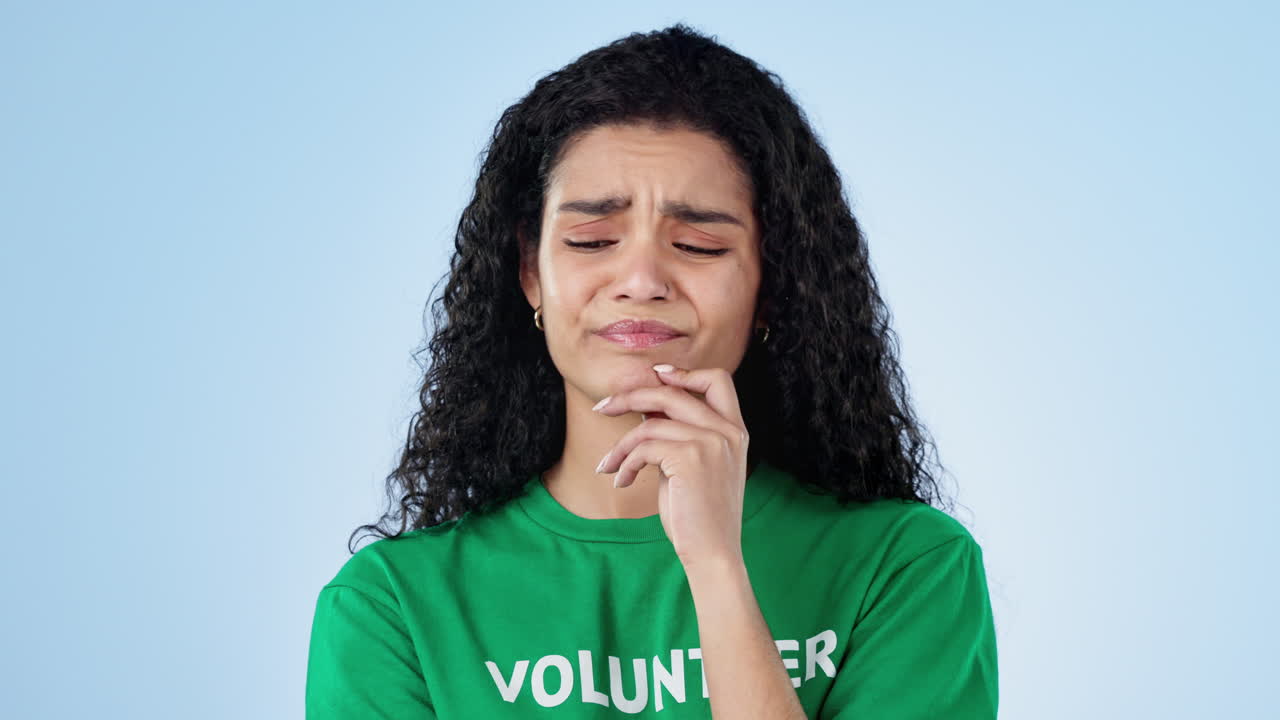 Thinking, no and face of woman volunteer in studio