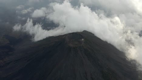 aerial view of izalco volcano in el salvador with cloudy skies and rugged terrain