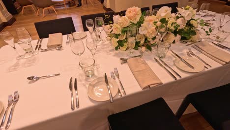 beautifully arranged table with flowers and cutlery