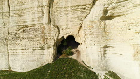 white cliff with cave