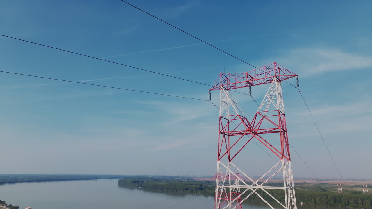 High Voltage Transmission Tower Over a River