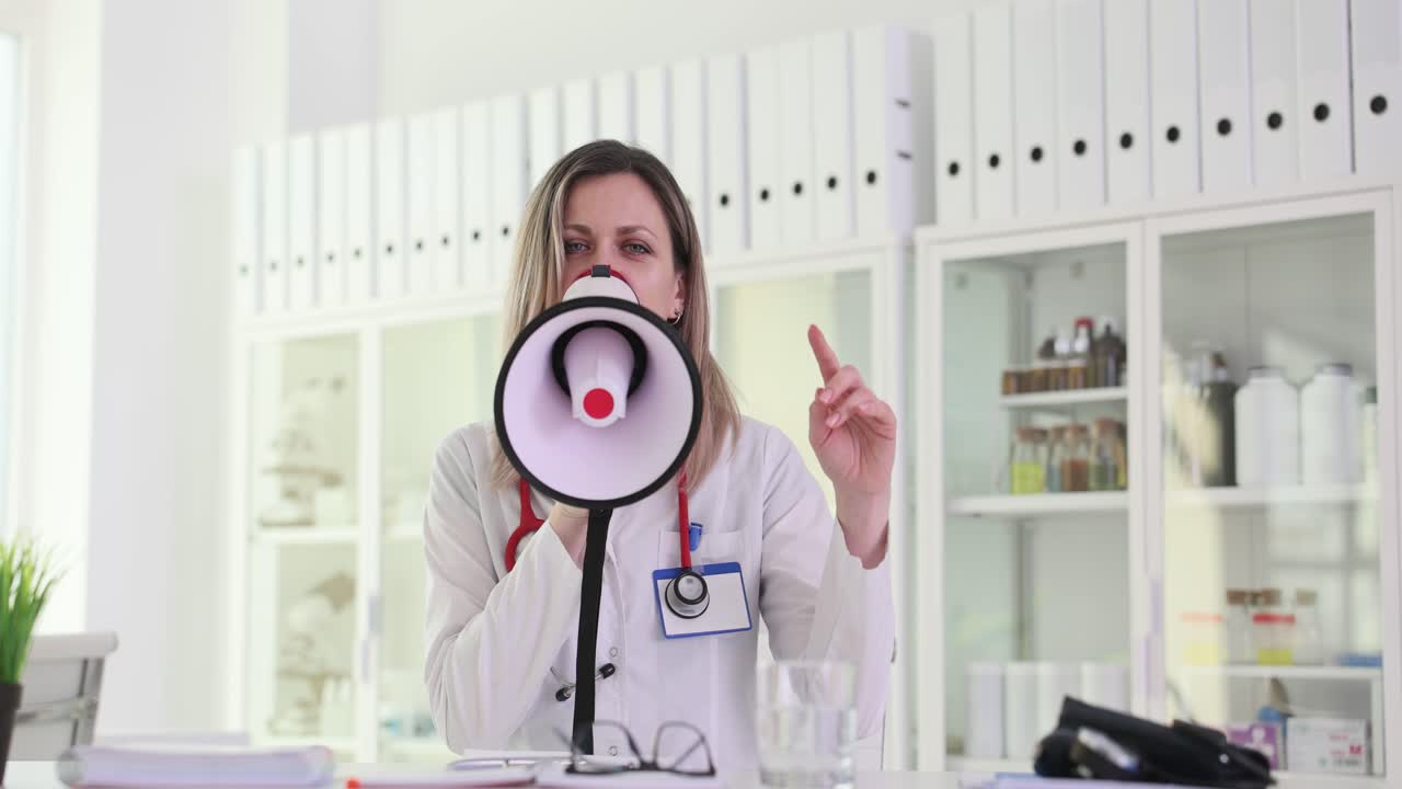 Doctor Making an Announcement with a Megaphone in a Clinic