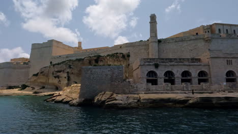 transition of historical building off port of valletta malta on the mediterranean sea