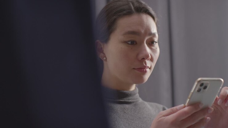 Pleased Young Woman At Home Receiving Text Message Confirming Job Offer 2