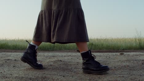 woman walking through a field