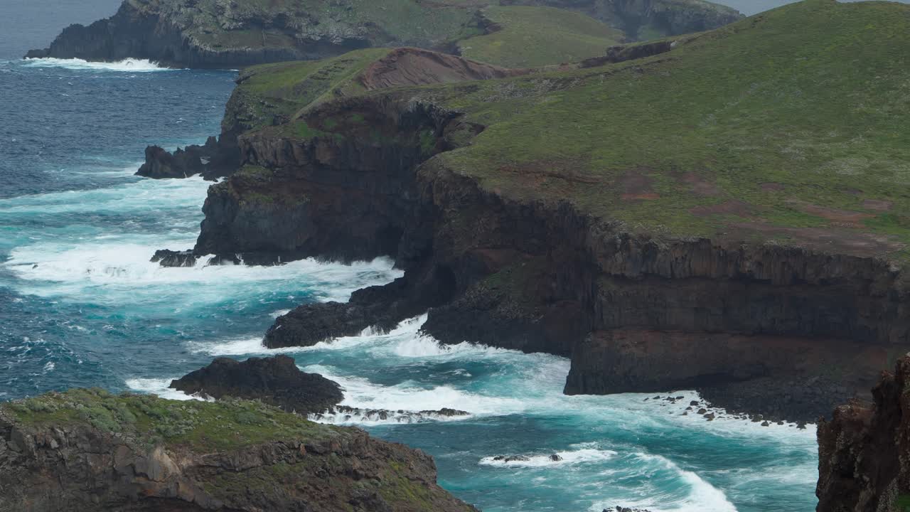 Ocean waves crush on cliffs at Ponta de Sao Lourenco peninsula Madeira Portugal