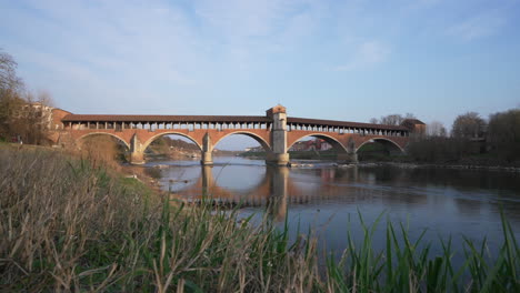 ponte coperto is a bridge over the ticino river in pavia at sunny day,slow-motion, lombardy, italy