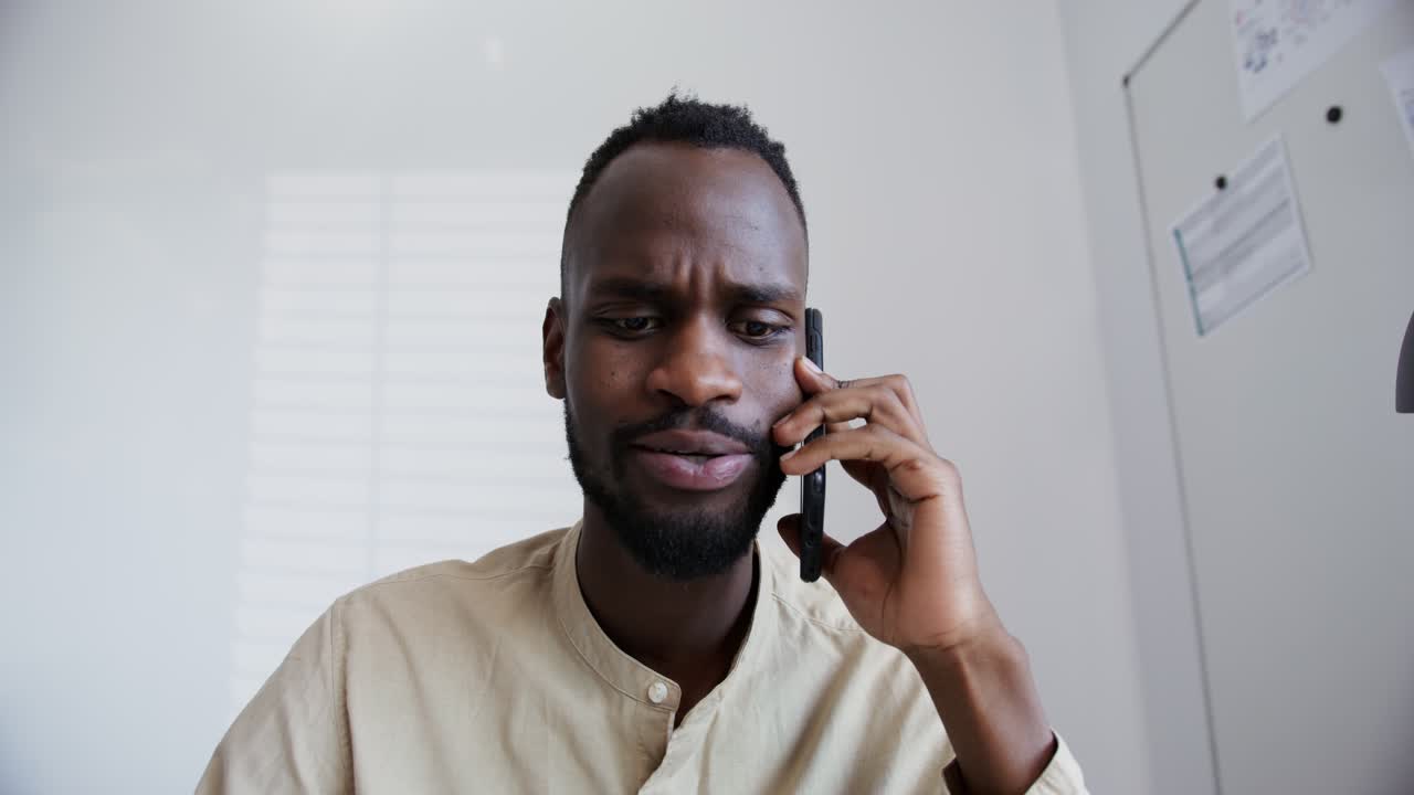 Man on Phone in Office