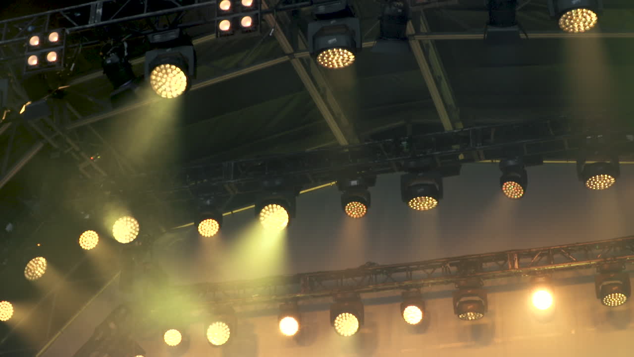 Multi-coloured, rotating concert stage lights.