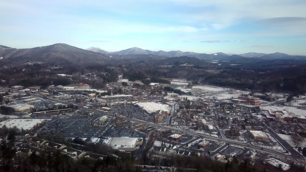 Aerial Push high over Boone North Carolina in Snow