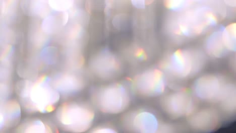 abstract bokeh lights with soft light background, bokeh blurred of chrystal chandelier.